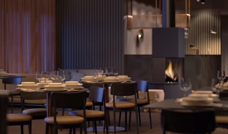 Modern Nordic restaurant in the Hotel Kuura with ambient lighting and dark tones